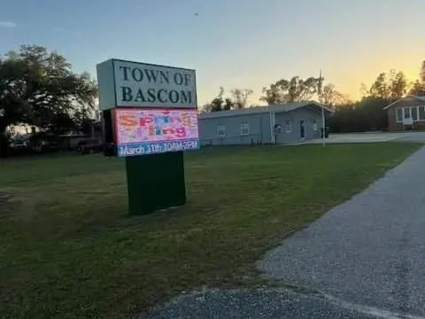 Mowed lawn beside a Town of Bascom sign